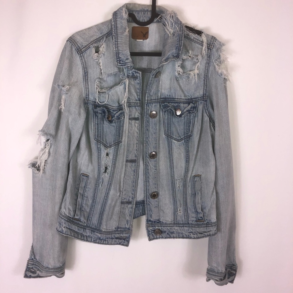 Distressed women’s light denim jacket